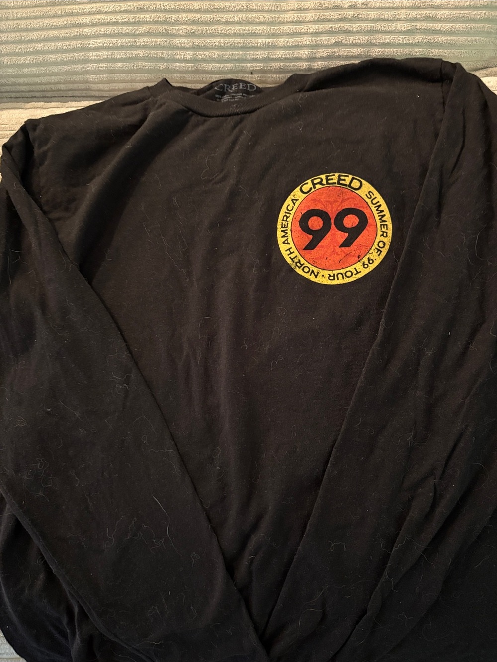 Creed Black Long Sleeve Shirt with Red and Yellow '99' Emblem